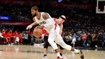 LOS ANGELES, CALIFORNIA - NOVEMBER 14: Paul George #13 of the LA Clippers dribbles the ball against Alex Caruso #6 of the Chicago Bulls during the second half at Staples Center on November 14, 2021 in Los Angeles, California. NOTE TO USER: User expressly acknowledges and agrees that, by downloading and/or using this Photograph, user is consenting to the terms and conditions of the Getty Images License Agreement. (Photo by Allen Berezovsky/Getty Images)