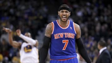 Mar 30, 2014; Oakland, CA, USA; New York Knicks forward Carmelo Anthony (7) reacts on the court against the Golden State Warriors in the fourth quarter at Oracle Arena. The Knicks won 89-84. Mandatory Credit: Cary Edmondson-USA TODAY Sports