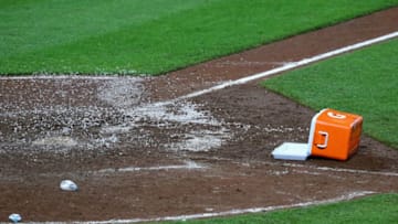 BALTIMORE, MD - SEPTEMBER 05: A cooler sits near home plate after Manny Machado