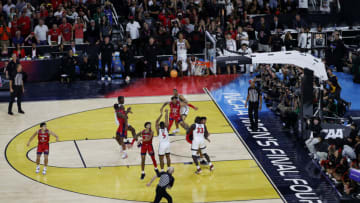 HOUSTON, TEXAS - APRIL 01: Lamont Butler #5 of the San Diego State Aztecs makes a basket as the clock expires to defeat the Florida Atlantic Owls 72-71 during the NCAA Men's Basketball Tournament Final Four semifinal game at NRG Stadium on April 01, 2023 in Houston, Texas. (Photo by Mike Lawrie/Getty Images)