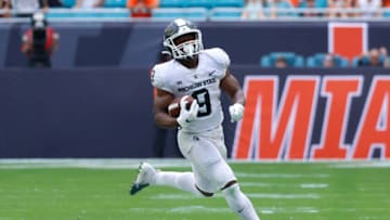 MIAMI GARDENS, FL - SEPTEMBER 18: Kenneth Walker III #9 of the Michigan State Spartans runs with the ball against the Miami Hurricanes on September 18, 2021 at Hard Rock Stadium in Miami Gardens, Florida. . (Photo by Joel Auerbach/Getty Images)