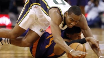 Dec 21, 2015; Salt Lake City, UT, USA; Utah Jazz guard Alec Burks (10) and Phoenix Suns guard Ronnie Price (14) dive for the loose ball during their game at vivint.SmartHome Arena. The Utah Jazz defeated Phoenix Suns 110-89. Mandatory Credit: Jeff Swinger-USA TODAY Sports