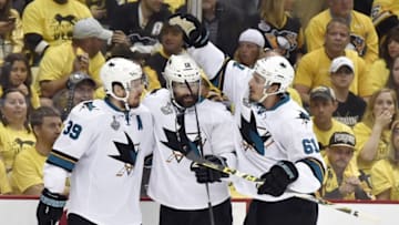Jun 9, 2016; Pittsburgh, PA, USA; San Jose Sharks center Logan Couture (39) celebrates with center Patrick Marleau (12) and defenseman Justin Braun (61) after scoring a goal against the Pittsburgh Penguins in the first period in game five of the 2016 Stanley Cup Final at Consol Energy Center. Mandatory Credit: Charles LeClaire-USA TODAY Sports