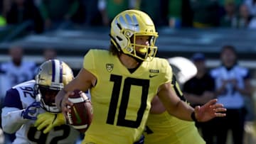 EUGENE, OR - OCTOBER 13: Quarterback Justin Herbert #10 of the Oregon Ducks scrambles in the first half of the game at Autzen Stadium on October 13, 2018 in Eugene, Oregon. The Ducks won the game 30-27. (Photo by Steve Dykes/Getty Images)