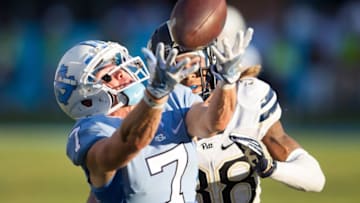 Sep 24, 2016; Chapel Hill, NC, USA; North Carolina Tar Heels wide receiver Austin Proehl (7) catches a pass while being defended by Pittsburgh Panthers defensive back Ryan Lewis (38) during the third quarter at Kenan Memorial Stadium. Carolina defeated Pitt 37-36. Mandatory Credit: Jeremy Brevard-USA TODAY Sports