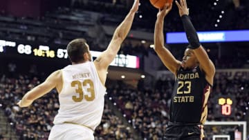 Jan 25, 2020; Tallahassee, Florida, USA; Florida State Seminoles guard MJ Walker (23) shoots the ball over Notre Dame Fighting Irish forward John Mooney (33) during the second half at Donald L. Tucker Center. Mandatory Credit: Melina Myers-USA TODAY Sports