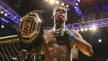 ATLANTA, GA - APRIL 13: Israel Adesanya holds up the belt after defeating Kelvin Gastelum by unanimous decision in their interim middleweight championship bout during the UFC 236 event at State Farm Arena on April 13, 2019 in Atlanta, Georgia. (Photo by Carmen Mandato/Zuffa LLC via Getty Images)