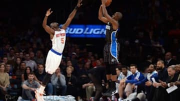 Dec 6, 2013; New York, NY, USA; Orlando Magic shooting guard Doron Lamb (1) takes a shot over New York Knicks shooting guard Tim Hardaway Jr. (5) during the second half at Madison Square Garden. The Knicks won the game 121-83. Mandatory Credit: Joe Camporeale-USA TODAY Sports