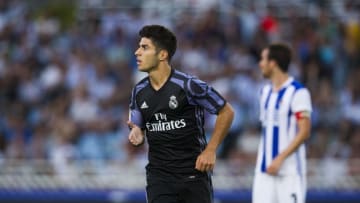SAN SEBASTIAN, SPAIN - AUGUST 21: Marco Asensio of Real Madrid celebrates after scoring his team's second goal during the La Liga match between Real Sociedad de Futbol and Real Madrid at Estadio Anoeta on August 21, 2016 in San Sebastian, Spain. (Photo by Juan Manuel Serrano Arce/Getty Images)