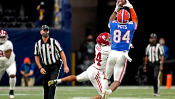 Dec 19, 2020; Atlanta, Georgia, USA; Florida Gators tight end Kyle Pitts (84) catches the ball against Alabama Crimson Tide defensive back Brian Branch (14) during the first quarter in the SEC Championship at Mercedes-Benz Stadium. Mandatory Credit: Dale Zanine-USA TODAY Sports