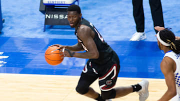 Mar 6, 2021; Lexington, Kentucky, USA; South Carolina Gamecocks forward Keyshawn Bryant (24) dribbles the ball while being guarded by Kentucky Wildcats forward Isaiah Jackson (23) during the first half of the game at Rupp Arena at Central Bank Center. Mandatory Credit: Arden Barnes-USA TODAY Sports