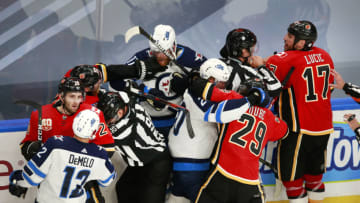 Calgary Flames and Winnipeg Jets fight (Photo by Jeff Vinnick/Getty Images)