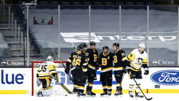 BOSTON, MASSACHUSETTS - JANUARY 26: Nick Ritchie #21 of the Boston Bruins, center, celebrates with David Krejci #46, Brad Marchand #63 and Charlie McAvoy after scoring a goal against the Pittsburgh Penguins during the first period at TD Garden on January 26, 2021 in Boston, Massachusetts. (Photo by Maddie Meyer/Getty Images)