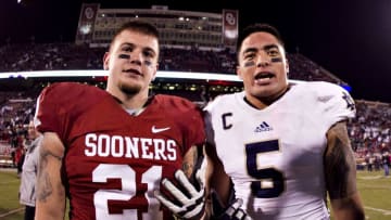 NORMAN, OK - OCTOBER 27: Manti Te'o #5 of the Notre Dame Fighting Irish and Tom Wort #21 of the Oklahoma Sooners talk after the game at Gaylord Family Oklahoma Memorial Stadium on October 27, 2012 in Norman, Oklahoma. The Fighting Irish defeated the Sooners 30-13. (Photo by Wesley Hitt/Getty Images)