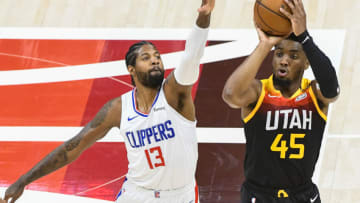 Donovan Mitchell #45 of the Utah Jazz shoots over Paul George #13 of the LA Clippers(Photo by Alex Goodlett/Getty Images)