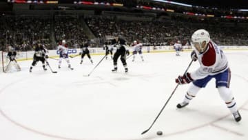 Jan 22, 2014; Pittsburgh, PA, USA; Montreal Canadiens defenseman Josh Gorges (26) skates with the puck against the Pittsburgh Penguins during the third period at the CONSOL Energy Center. Pittsburgh won 5-1. Mandatory Credit: Charles LeClaire-USA TODAY Sports