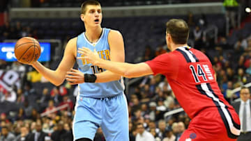 Dec 8, 2016; Washington, DC, USA; Denver Nuggets forward Nikola Jokic (15) looks to pass as Washington Wizards forward Jason Smith (14) defends during the first half at Verizon Center. Mandatory Credit: Brad Mills-USA TODAY Sports