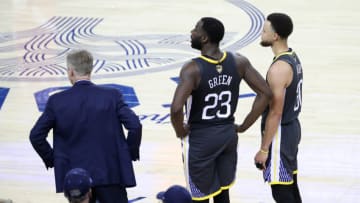 OAKLAND, CA - JUNE 13: Draymond Green #23 and Stephen Curry #30 of the Golden State Warriors look on during Game Six of the NBA Finals on June 13, 2019 at ORACLE Arena in Oakland, California. NOTE TO USER: User expressly acknowledges and agrees that, by downloading and/or using this photograph, user is consenting to the terms and conditions of Getty Images License Agreement. Mandatory Copyright Notice: Copyright 2019 NBAE (Photo by Joe Murphy/NBAE via Getty Images)