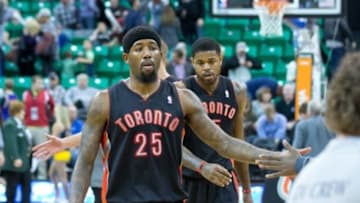 Feb 3, 2014; Salt Lake City, UT, USA; Toronto Raptors small forward John Salmons (25) and power forward Amir Johnson (15) leave the court after defeating the Utah Jazz 94-79 at EnergySolutions Arena. Mandatory Credit: Russ Isabella-USA TODAY Sports