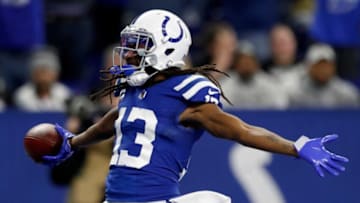 Indianapolis Colts wide receiver T.Y. Hilton (13) celebrates after catching the ball for a touchdown after it's juggled by Indianapolis Colts wide receiver Ashton Dulin (16), Las Vegas Raiders free safety Tre'von Moehrig (25) and Las Vegas Raiders cornerback Casey Hayward Jr. (29) on Sunday, Jan. 2, 2022, during a game against the Las Vegas Raiders at Lucas Oil Stadium in Indianapolis.