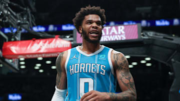 Mar 27, 2022; Brooklyn, New York, USA; Charlotte Hornets forward Miles Bridges (0) reacts after being fouled during the first half against the Brooklyn Nets at Barclays Center. Mandatory Credit: Vincent Carchietta-USA TODAY Sports