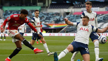 Manchester United's English striker Marcus Rashford (L) kicks the ball before Tottenham Hotspur's English defender Eric Dier during the English Premier League football match between Tottenham Hotspur and Manchester United at Tottenham Hotspur Stadium in London, on April 11, 2021. - - RESTRICTED TO EDITORIAL USE. No use with unauthorized audio, video, data, fixture lists, club/league logos or 'live' services. Online in-match use limited to 120 images. An additional 40 images may be used in extra time. No video emulation. Social media in-match use limited to 120 images. An additional 40 images may be used in extra time. No use in betting publications, games or single club/league/player publications. (Photo by MATTHEW CHILDS / POOL / AFP) / RESTRICTED TO EDITORIAL USE. No use with unauthorized audio, video, data, fixture lists, club/league logos or 'live' services. Online in-match use limited to 120 images. An additional 40 images may be used in extra time. No video emulation. Social media in-match use limited to 120 images. An additional 40 images may be used in extra time. No use in betting publications, games or single club/league/player publications. / RESTRICTED TO EDITORIAL USE. No use with unauthorized audio, video, data, fixture lists, club/league logos or 'live' services. Online in-match use limited to 120 images. An additional 40 images may be used in extra time. No video emulation. Social media in-match use limited to 120 images. An additional 40 images may be used in extra time. No use in betting publications, games or single club/league/player publications. (Photo by MATTHEW CHILDS/POOL/AFP via Getty Images)