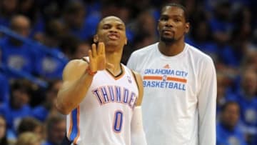 Apr 19, 2014; Oklahoma City, OK, USA; Oklahoma City Thunder guard Russell Westbrook (0) and forward Kevin Durant (35) prepare to return to the game against the Memphis Grizzlies in game one during the first round of the 2014 NBA Playoffs at Chesapeake Energy Arena. Mandatory Credit: Mark D. Smith-USA TODAY Sports