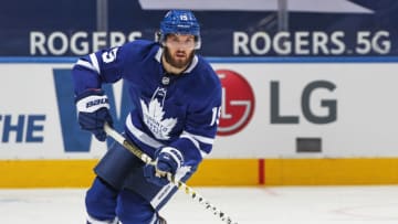 TORONTO, ON - MARCH 27: Alexander Kerfoot #15 of the Toronto Maple Leafs heads up ice with the puck against the Edmonton Oilers during an NHL game at Scotiabank Arena on March 27, 2021 in Toronto, Ontario, Canada. The Maple Leafs defeated the Oilers 4-3 in overtime. (Photo by Claus Andersen/Getty Images)