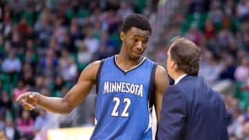 Mar 23, 2015; Salt Lake City, UT, USA; Minnesota Timberwolves forward Andrew Wiggins (22) talks with head coach Flip Saunders during the first quarter against the Utah Jazz at EnergySolutions Arena. Mandatory Credit: Russ Isabella-USA TODAY Sports