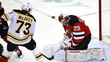 NEWARK, NEW JERSEY - JANUARY 14: Mackenzie Blackwood #29 of the New Jersey Devils stops a shot by Charlie McAvoy #73 of the Boston Bruins in the first period during the home opening game at Prudential Center on January 14, 2021 in Newark, New Jersey. (Photo by Elsa/Getty Images)