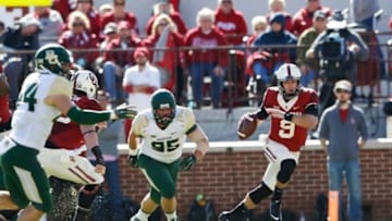 Nov 8, 2014; Norman, OK, USA; Oklahoma Sooners quarterback Trevor Knight (9) runs past Baylor Bears defensive lineman Beau Blackshear (95) during the first quarter at Gaylord Family - Oklahoma Memorial Stadium. Mandatory Credit: Kevin Jairaj-USA TODAY Sports