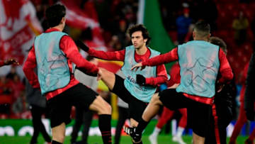 Atletico Madrid's Portuguese striker Joao Felix (C) warms up before the UEFA Champions league Round of 16 second leg football match between Liverpool and Atletico Madrid at Anfield in Liverpool, north west England on March 11, 2020. (Photo by JAVIER SORIANO / AFP) (Photo by JAVIER SORIANO/AFP via Getty Images)