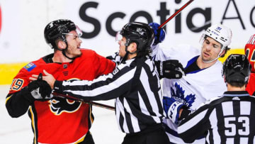 Matthew Tkachuk #19 of the Calgary Flames shoves John Tavares #91 of the Toronto Maple Leafs. (Photo by Derek Leung/Getty Images)