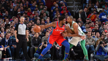 PHILADELPHIA, PA - FEBRUARY 12: Joel Embiid #21 of the Philadelphia 76ers handles the ball against the Boston Celtics on February 12, 2019 at the Wells Fargo Center in Philadelphia, Pennsylvania NOTE TO USER: User expressly acknowledges and agrees that, by downloading and/or using this Photograph, user is consenting to the terms and conditions of the Getty Images License Agreement. Mandatory Copyright Notice: Copyright 2019 NBAE (Photo by Jesse D. Garrabrant/NBAE via Getty Images)