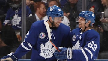 TORONTO, ONTARIO - NOVEMBER 09: Josh Leivo #32 of the Toronto Maple Leafs congratulates Tyler Ennis #63 of the Toronto Maple Leafs on his third period goal against the New Jersey Devils at the Scotiabank Arena on November 09, 2018 in Toronto, Ontario, Canada. The Leafs defeated the Devils 6-1. (Photo by Bruce Bennett/Getty Images)