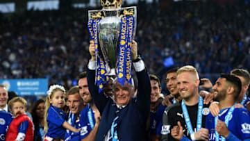 LEICESTER, ENGLAND - MAY 07: Claudio Ranieri lifts the Premier League Trophy as players and staffs celebrate the season champions after the Barclays Premier League match between Leicester City and Everton at The King Power Stadium on May 7, 2016 in Leicester, United Kingdom. (Photo by Shaun Botterill/Getty Images)
