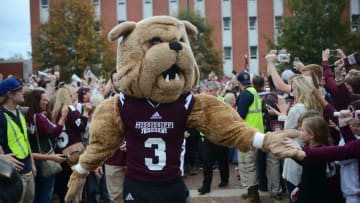 Nov 28, 2015; Starkville, MS, USA; Mississippi State Bulldogs mascot Bully greets fans in the Junction before the game against the Mississippi Rebels at Davis Wade Stadium. Mississippi won 38-27. Mandatory Credit: Matt Bush-USA TODAY Sports