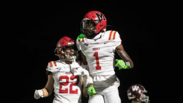 Teddy Foster and Carson Beach of Cardinal Mooney celebrate a touchdown catch by Foster on Friday, Sept. 9, 2022, at First Baptist Academy in Naples.Ndn 090922 Ai Fbamooney 002