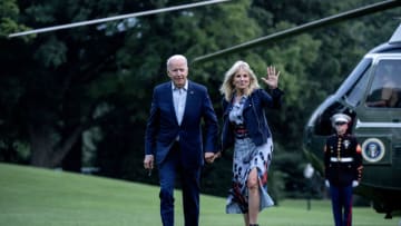WASHINGTON, DC - JULY 18: U.S. President Joe Biden and first lady Jill Biden walk on the South Lawn of the White House on July 18, 2021 in Washington, DC. The Bidens were returning from a weekend at Camp David. (Photo by Stefani Reynolds/Getty Images)