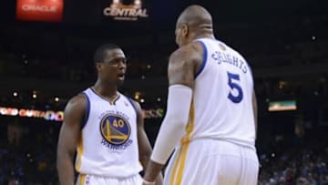April 4, 2014; Oakland, CA, USA; Golden State Warriors forward Harrison Barnes (40) celebrates with forward Marreese Speights (5) against the Sacramento Kings during the fourth quarter at Oracle Arena. The Warriors defeated the Kings 102-69. Mandatory Credit: Kyle Terada-USA TODAY Sports