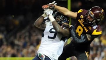 Jan 2, 2016; Phoenix, AZ, USA; West Virginia Mountaineers safety KJ Dillon (9) breaks up a pass intended for Arizona State Sun Devils wide receiver D.J. Foster (8) during the second half of the 2016 Cactus Bowl at Chase Field. The Mountaineers won 43-42. Mandatory Credit: Joe Camporeale-USA TODAY Sports
