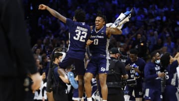 PHILADELPHIA, PENNSYLVANIA - MARCH 25: Jaylen Murray #32 and Latrell Reid #0 of the St. Peter's Peacocks celebrate after defeating the Purdue Boilermakers 67-64 in the Sweet Sixteen round game of the 2022 NCAA Men's Basketball Tournament at Wells Fargo Center on March 25, 2022 in Philadelphia, Pennsylvania. (Photo by Tim Nwachukwu/Getty Images)