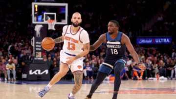 Oct 14, 2023; New York, New York, USA; New York Knicks guard Evan Fournier (13) brings the ball up court against Minnesota Timberwolves guard Shake Milton (18) during the fourth quarter at Madison Square Garden. Mandatory Credit: Brad Penner-USA TODAY Sports