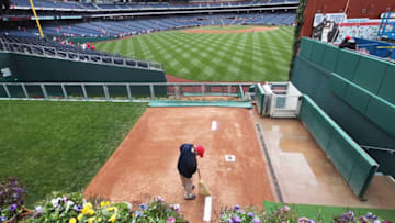 PHILADELPHIA, PA - APRIL 01: A grounds keeper sweeps the mound in the bullpen before the start of the opening day game between the Philadelphia Phillies and Houston Astros at Citizens Bank Park on April 1, 2011 in Philadelphia, Pennsylvania. (Photo by Rob Carr/Getty Images)