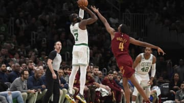 Mar 1, 2023; Boston, Massachusetts, USA; Boston Celtics guard Jaylen Brown (7) shoots the ball over Cleveland Cavaliers forward Evan Mobley (4) during the second half at TD Garden. Mandatory Credit: Bob DeChiara-USA TODAY Sports