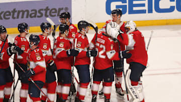SUNRISE, FL - MARCH 8: Teammates line up to congratulate Goaltender Roberto Luongo