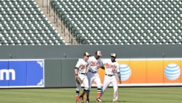 Apr 29, 2015; Baltimore, MD, USA; Baltimore Orioles outfielder react after defeating Chicago White Sox 8-2 at Oriole Park at Camden Yards. Fans are not allowed to attend the game due to the current state of unrest in Baltimore. Mandatory Credit: Tommy Gilligan-USA TODAY Sports
