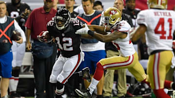 Dec 18, 2016; Atlanta, GA, USA; Atlanta Falcons wide receiver Mohamed Sanu (12) carries the ball as San Francisco 49ers cornerback Jimmie Ward (25) defends during the first quarter at the Georgia Dome. Mandatory Credit: Dale Zanine-USA TODAY Sports