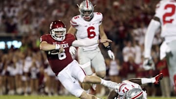 Sep 17, 2016; Norman, OK, USA; Oklahoma Sooners quarterback Baker Mayfield (6) runs as Ohio State Buckeyes linebacker Jerome Baker (17) defends during the first quarter at Gaylord Family - Oklahoma Memorial Stadium. Mandatory Credit: Kevin Jairaj-USA TODAY Sports