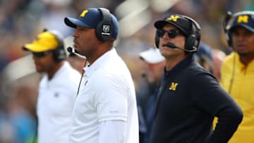 ANN ARBOR, MICHIGAN - OCTOBER 05: Offensive coordinator Josh Gattis look on with head coach Jim Harbaugh while playing the Iowa Hawkeyes at Michigan Stadium on October 05, 2019 in Ann Arbor, Michigan. Michigan won the game 10-3. (Photo by Gregory Shamus/Getty Images)